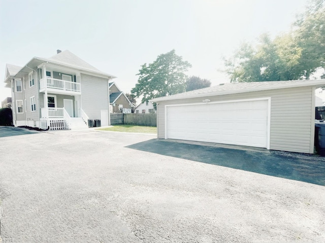 1509 Saint Charles Rd, Maywood, IL 60153 - view of property exterior featuring a balcony, an outdoor structure, and a garage