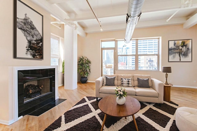 500 S Clinton St Unit 743, Chicago, IL 60607 - living room with wood finished floors, track lighting, and beam ceiling