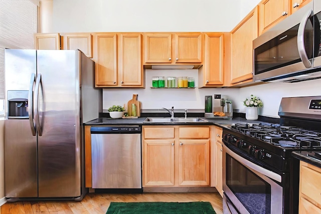 500 S Clinton St Unit 743, Chicago, IL 60607 - kitchen featuring stainless steel appliances, dark countertops, and light brown cabinets