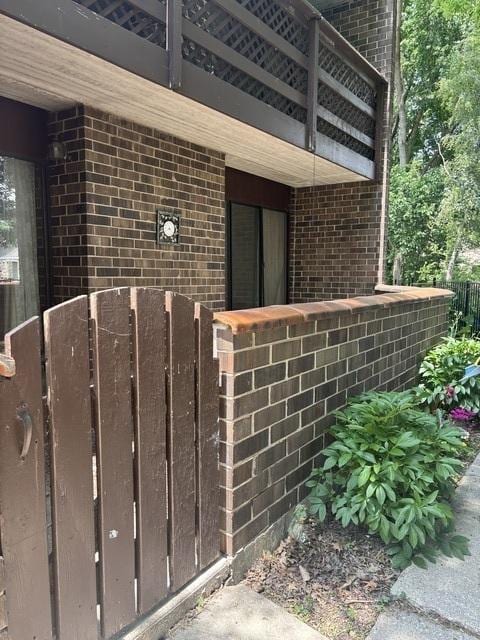 1705 Kenneth Cir Unit 1705, Elgin, IL 60120 - view of exterior entry with brick siding