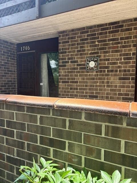 1705 Kenneth Cir Unit 1705, Elgin, IL 60120 - exterior view of brick siding and a bar