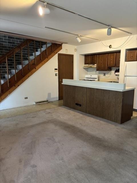 1705 Kenneth Cir Unit 1705, Elgin, IL 60120 - kitchen with freestanding refrigerator, stove, dark brown cabinets, and light countertops