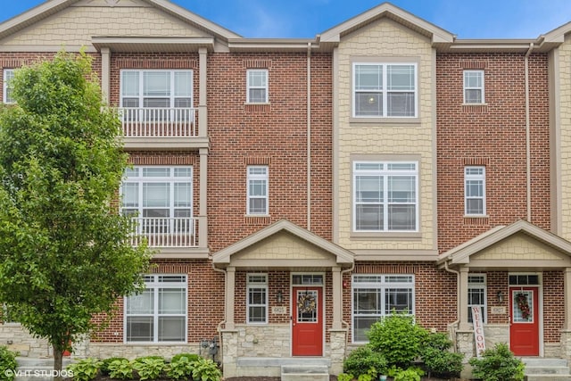 6825 179th St, Tinley Park, IL 60477 - townhome / multi-family property featuring entry steps, stone siding, and brick siding