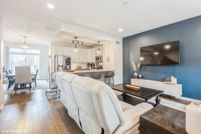 6825 179th St, Tinley Park, IL 60477 - living room with dark wood-type flooring, recessed lighting, and a chandelier