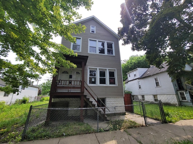 5307 S Emerald Ave, Chicago, IL 60609 - view of front of home with a gate, stairs, and a fenced front yard