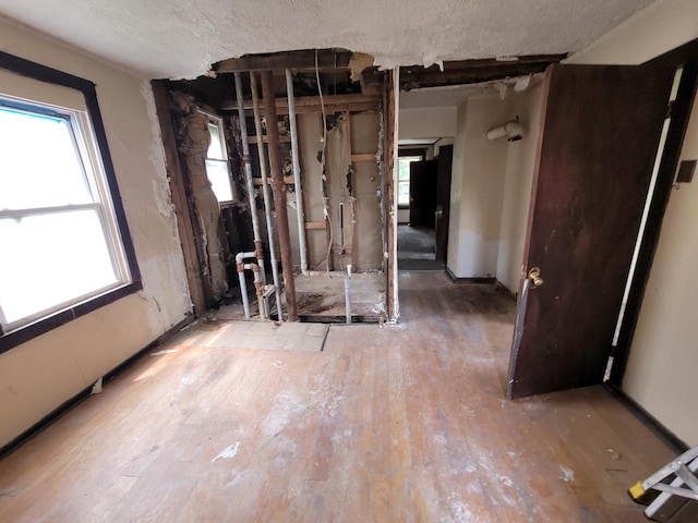 5307 S Emerald Ave, Chicago, IL 60609 - miscellaneous room featuring hardwood / wood-style flooring and a textured ceiling