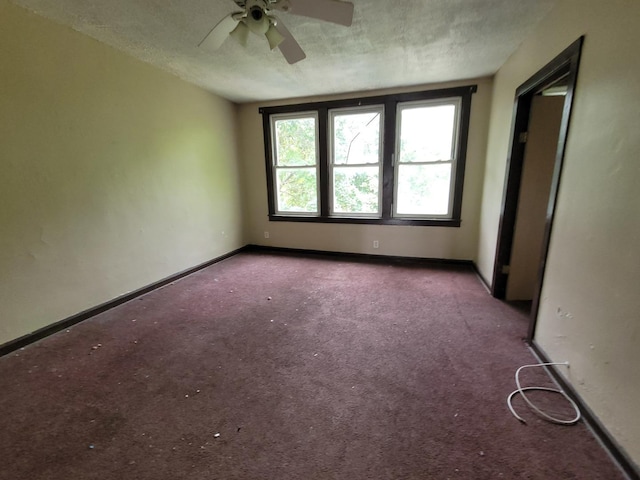 5307 S Emerald Ave, Chicago, IL 60609 - spare room with ceiling fan, a textured ceiling, and carpet