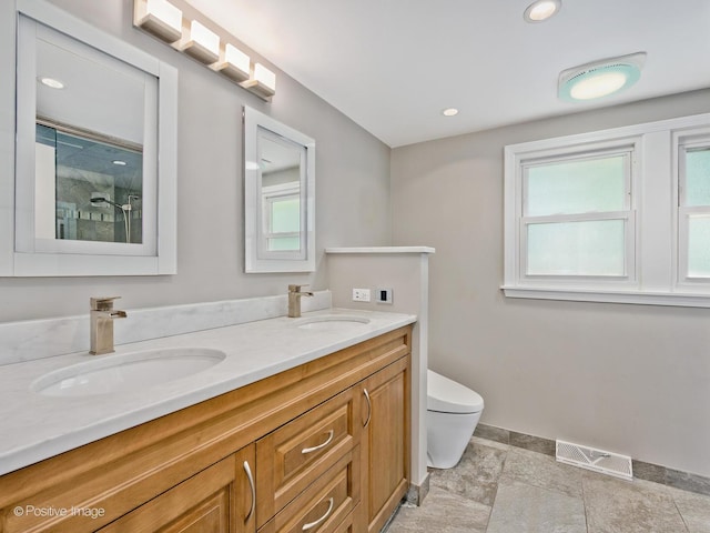2246 Strawberry Ln, Glenview, IL 60026 - full bathroom featuring double vanity, a shower with shower door, and recessed lighting