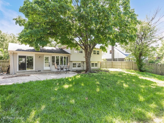 2246 Strawberry Ln, Glenview, IL 60026 - rear view of house with a fenced backyard and a patio