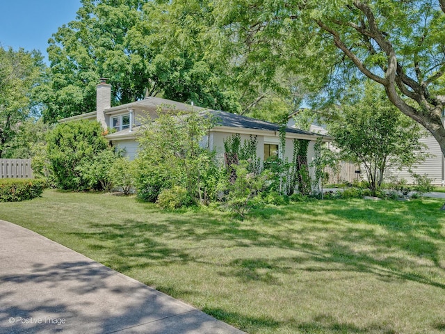 2246 Strawberry Ln, Glenview, IL 60026 - view of front of house featuring a chimney and a front yard
