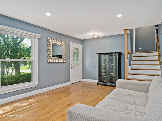 2246 Strawberry Ln, Glenview, IL 60026 - living area with wood finished floors, stairway, and recessed lighting