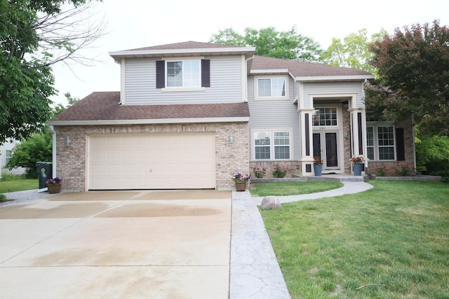 1061 Franklin St, Mundelein, IL 60060 - view of front of property featuring driveway, a front yard, brick siding, a shingled roof, and a garage
