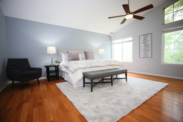 1061 Franklin St, Mundelein, IL 60060 - bedroom with multiple windows, high vaulted ceiling, and wood finished floors