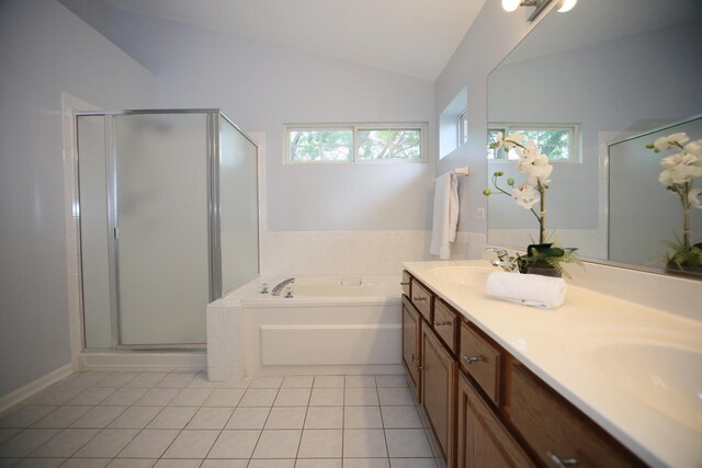 1061 Franklin St, Mundelein, IL 60060 - bathroom with tile patterned floors, lofted ceiling, a garden tub, a shower stall, and double vanity