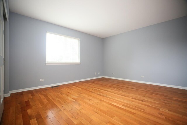 1061 Franklin St, Mundelein, IL 60060 - spare room with light wood finished floors and baseboards