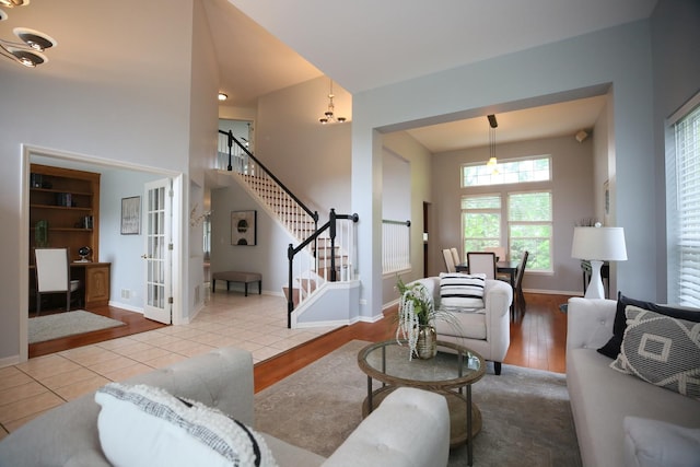 1061 Franklin St, Mundelein, IL 60060 - living area featuring stairway, wood finished floors, french doors, and a towering ceiling