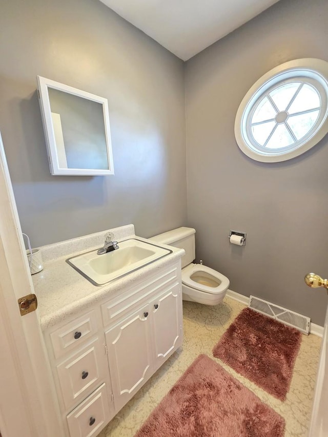 727 N Fordham Ave, Aurora, IL 60506 - half bathroom featuring vanity and toilet