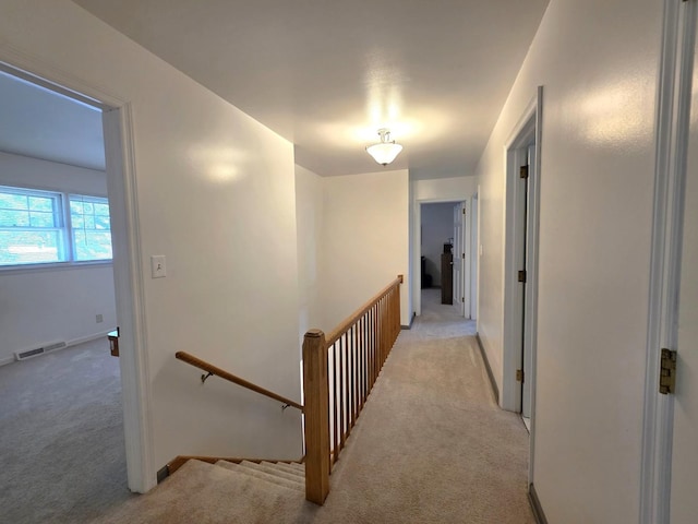 727 N Fordham Ave, Aurora, IL 60506 - hallway featuring light carpet and an upstairs landing