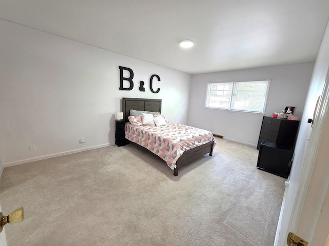 727 N Fordham Ave, Aurora, IL 60506 - bedroom with baseboards and carpet flooring