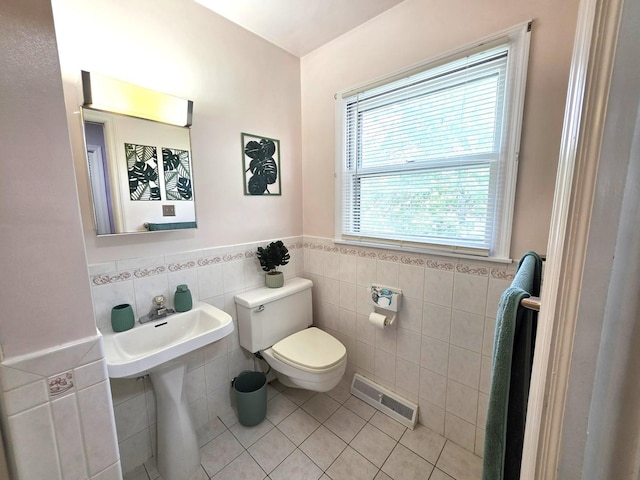 727 N Fordham Ave, Aurora, IL 60506 - bathroom featuring tile walls, tile patterned flooring, and wainscoting