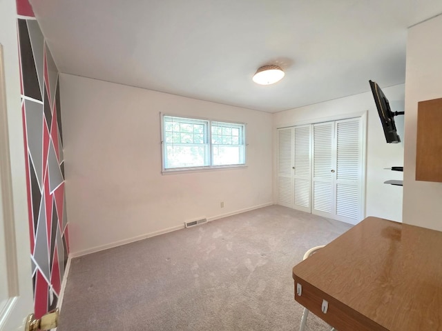 727 N Fordham Ave, Aurora, IL 60506 - unfurnished bedroom with light colored carpet and a closet