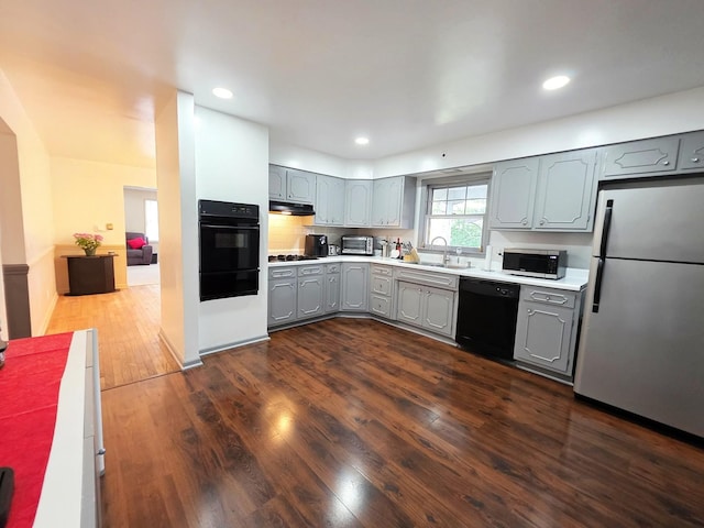 727 N Fordham Ave, Aurora, IL 60506 - kitchen featuring black appliances, gray cabinets, a warming drawer, dark wood-style flooring, and light countertops