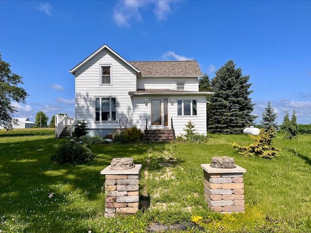 1116 E 2300 N Rd, Danforth, IL 60930 - rear view of house featuring a lawn, a shingled roof, and entry steps