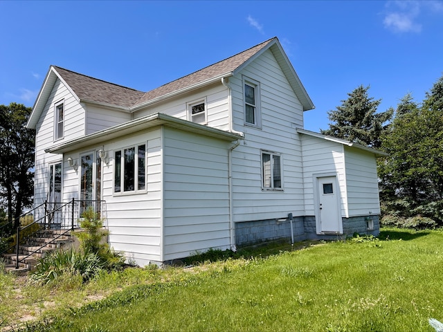 1116 E 2300 N Rd, Danforth, IL 60930 - view of home's exterior featuring a yard and roof with shingles