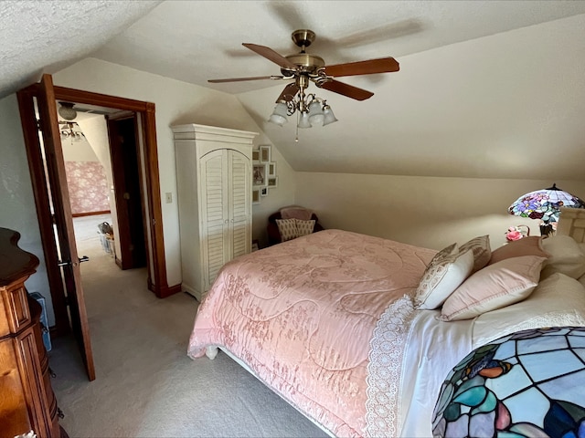 1116 E 2300 N Rd, Danforth, IL 60930 - bedroom featuring light colored carpet, vaulted ceiling, a ceiling fan, and a closet