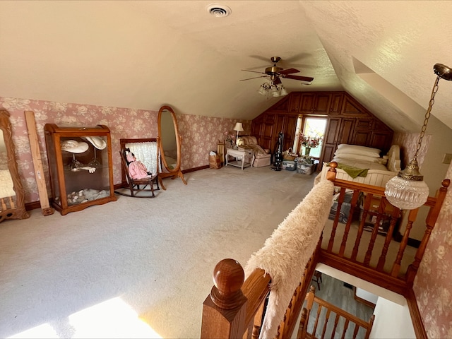1116 E 2300 N Rd, Danforth, IL 60930 - bedroom with wallpapered walls, vaulted ceiling, light carpet, and ceiling fan
