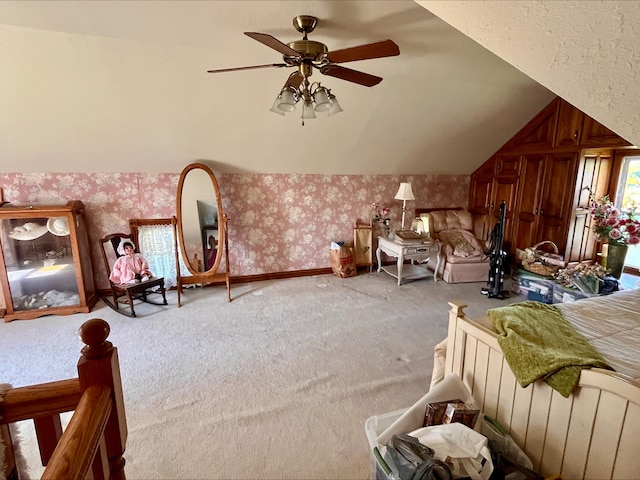 1116 E 2300 N Rd, Danforth, IL 60930 - carpeted bedroom featuring wallpapered walls, lofted ceiling, and a ceiling fan