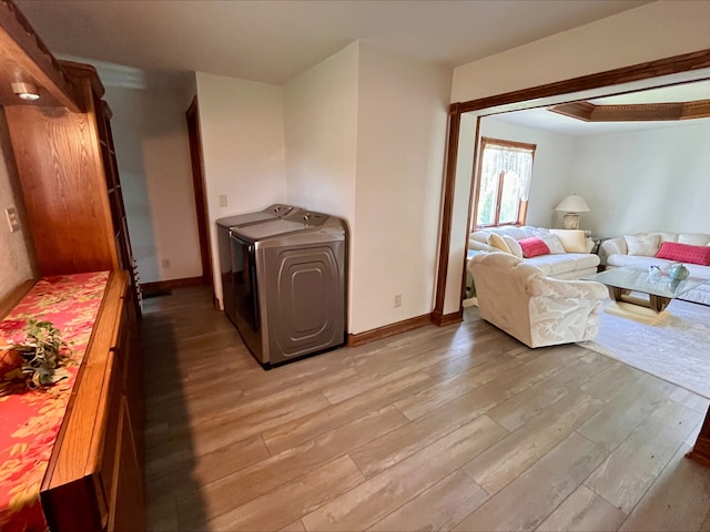 1116 E 2300 N Rd, Danforth, IL 60930 - living area with light wood-style flooring and washing machine and dryer