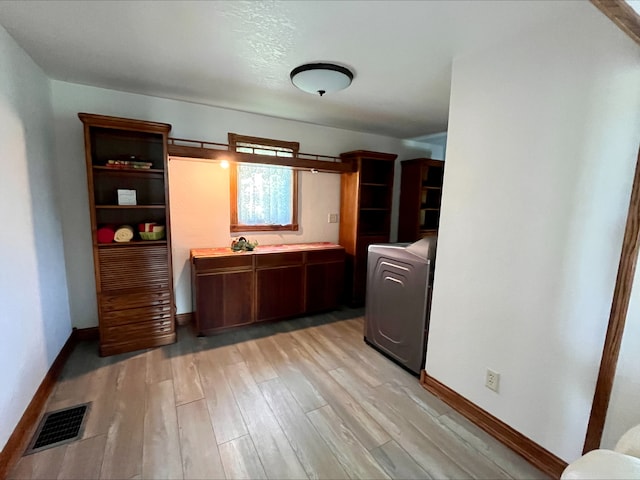 1116 E 2300 N Rd, Danforth, IL 60930 - kitchen featuring washer / clothes dryer, light wood finished floors, open shelves, and light countertops