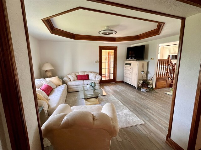 1116 E 2300 N Rd, Danforth, IL 60930 - living area featuring a raised ceiling, wood finished floors, and crown molding