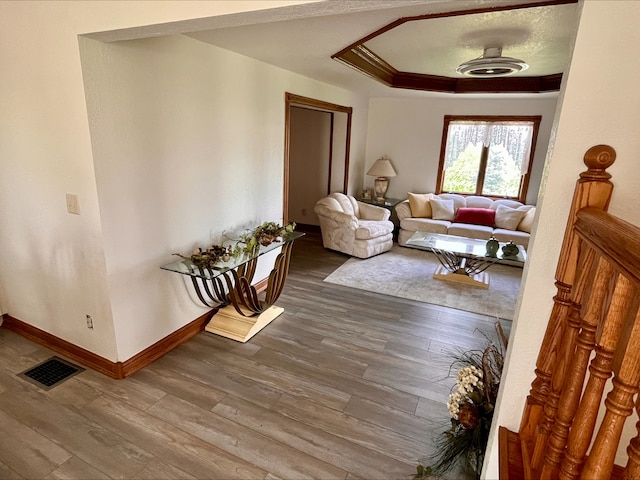 1116 E 2300 N Rd, Danforth, IL 60930 - living area with wood finished floors, a tray ceiling, and crown molding