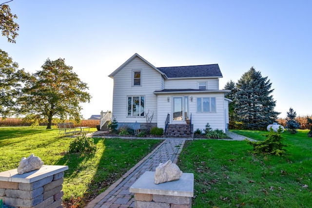 1116 E 2300 N Rd, Danforth, IL 60930 - traditional-style home with a front yard and a shingled roof