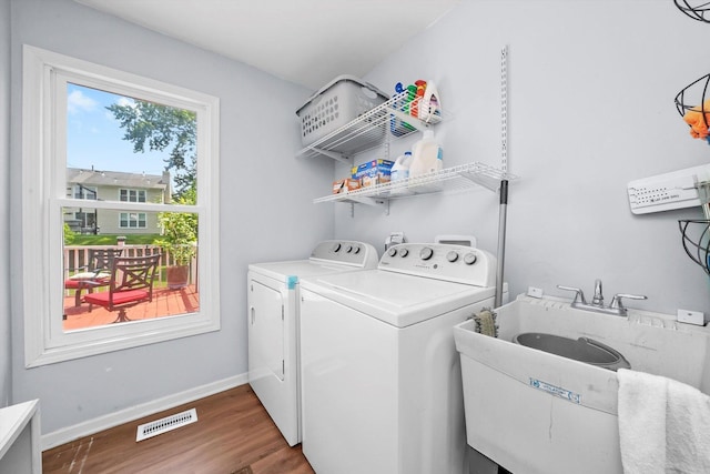 1140 Willoby Ln, Elgin, IL 60120 - laundry area with independent washer and dryer and wood finished floors