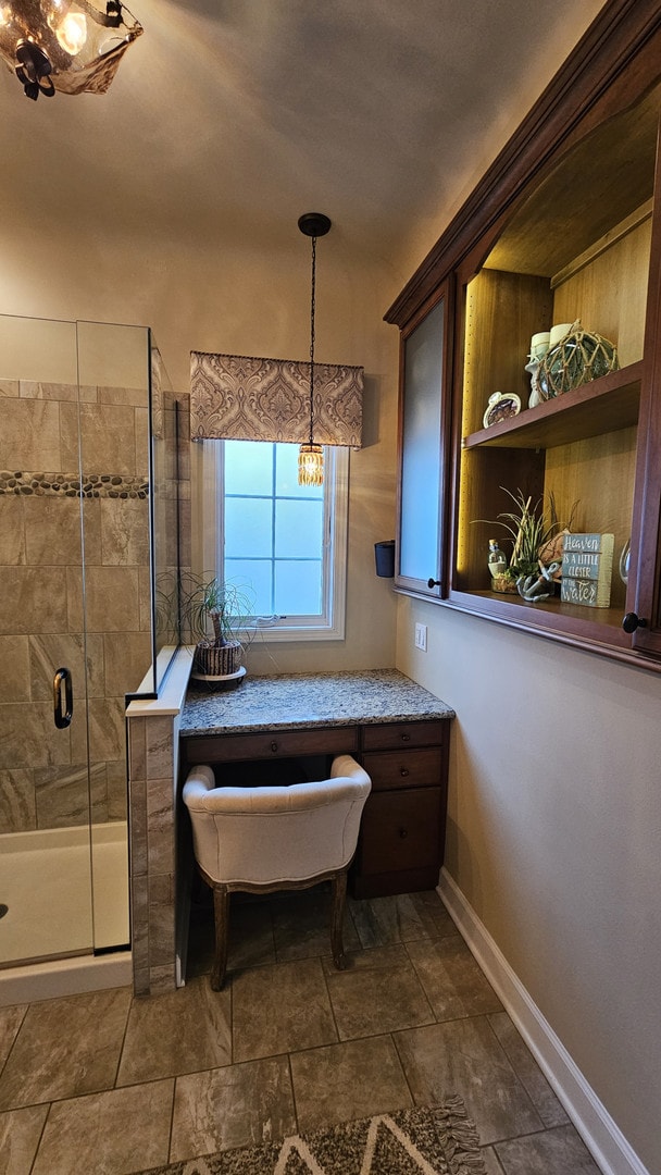 40752 N Grand Ave, Antioch, IL 60002 - full bathroom featuring a shower stall and a chandelier