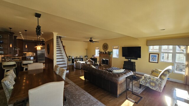 40752 N Grand Ave, Antioch, IL 60002 - living room featuring ceiling fan, dark wood-type flooring, healthy amount of natural light, and stairs