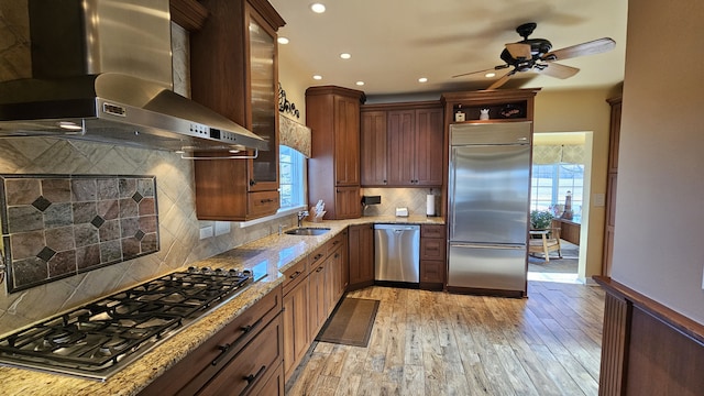 40752 N Grand Ave, Antioch, IL 60002 - kitchen with wall chimney exhaust hood, appliances with stainless steel finishes, ceiling fan, light wood-type flooring, and light stone countertops