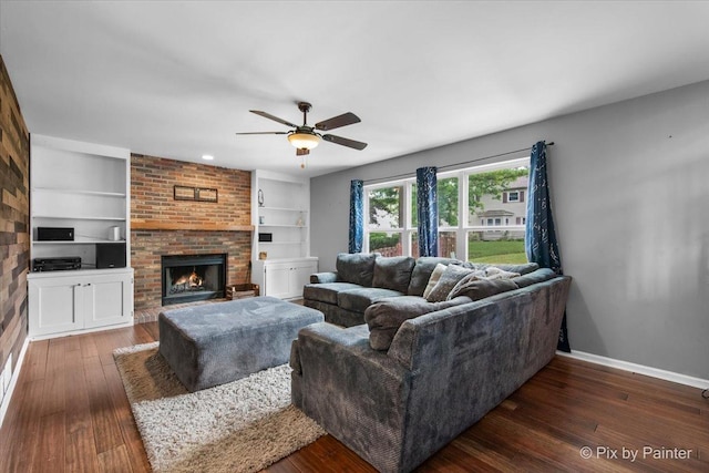903 Pin Oak Cir, Cary, IL 60013 - living room featuring hardwood / wood-style floors, a ceiling fan, a fireplace, and built in features