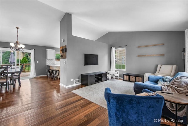 903 Pin Oak Cir, Cary, IL 60013 - living room with a chandelier, vaulted ceiling, dark wood-type flooring, and plenty of natural light