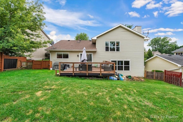 903 Pin Oak Cir, Cary, IL 60013 - rear view of house featuring a chimney, a deck, and a fenced backyard