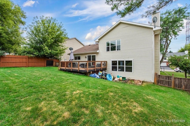 903 Pin Oak Cir, Cary, IL 60013 - rear view of house with a fenced backyard, a wooden deck, and a chimney