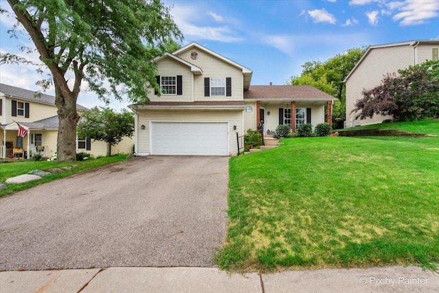 903 Pin Oak Cir, Cary, IL 60013 - tri-level home with asphalt driveway, a garage, and a front yard