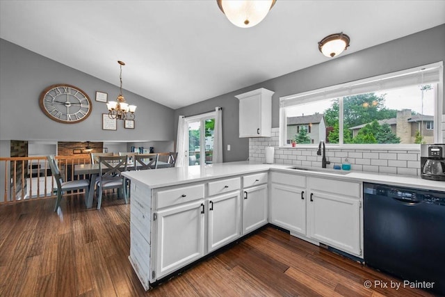 903 Pin Oak Cir, Cary, IL 60013 - kitchen with dishwasher, a peninsula, backsplash, light countertops, and lofted ceiling