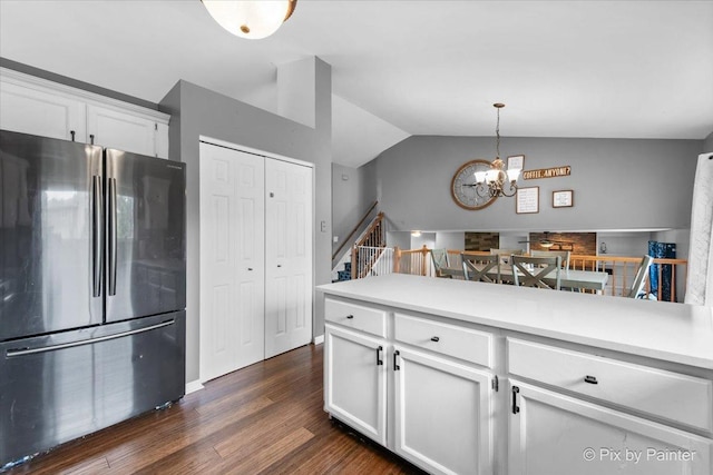 903 Pin Oak Cir, Cary, IL 60013 - kitchen featuring freestanding refrigerator, vaulted ceiling, white cabinets, a chandelier, and dark wood-style floors
