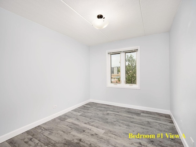 8540 W Foster Ave Unit 403, Norridge, IL 60706 - spare room with wood finished floors and a textured ceiling