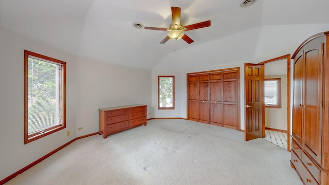 3354 N Overhill Ave, Chicago, IL 60634 - unfurnished bedroom with lofted ceiling, light carpet, and a ceiling fan