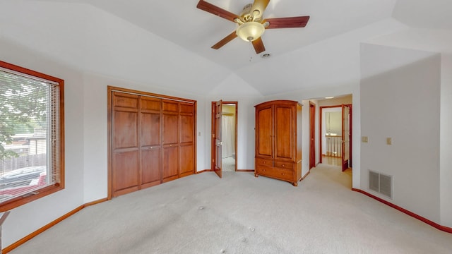 3354 N Overhill Ave, Chicago, IL 60634 - unfurnished bedroom featuring vaulted ceiling, light colored carpet, a closet, and ceiling fan